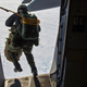 Illustration for article titled Check Out These Shots Of A C-17 Dropping Pararescuemen Over The Navy's Arctic Outpost